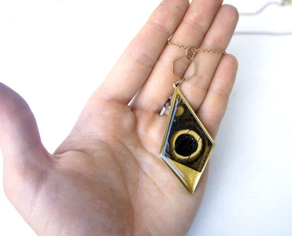 Owl eye wing kite necklace, detail view
