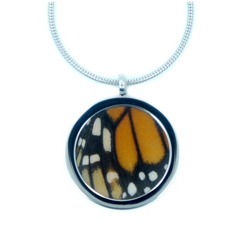 Real Monarch forewing in a round pendant necklace