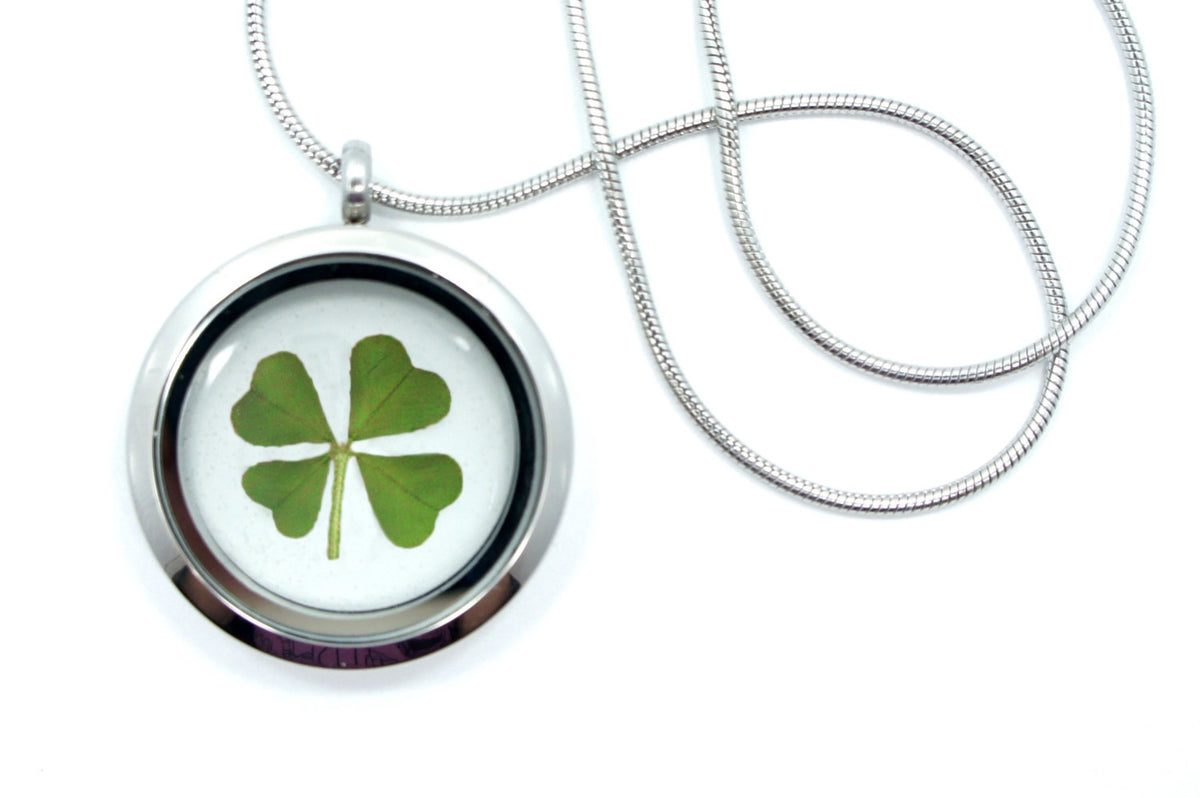 Real four leaf clover preserved in a clear resin pendant necklace